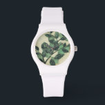 Löv och Grenar på Cream Background Armbandsur<br><div class="desc">Vibrant grönt löv och grenar vilar på en gräddbakgrund i den här utskriften av Jennifer Goldberger. Eftersom säsongen förändras förblir färg på dessa löv oförändrad,  vilket ger lite konsekvens i ditt liv.</div>