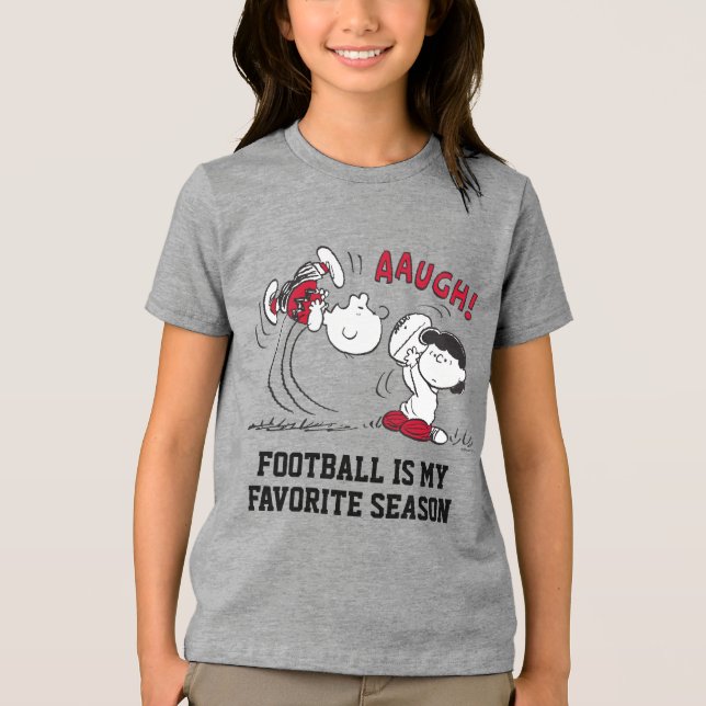 Lucy Pulls Way Football från Charlie Brown T Shirt (Framsida)