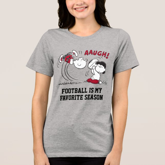 Lucy Pulls Way Football från Charlie Brown T Shirt (Framsida)