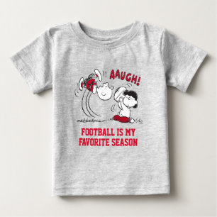 Lucy Pulls Way Football från Charlie Brown T Shirt
