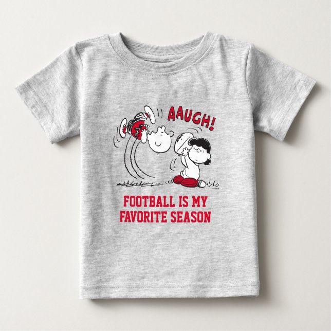 Lucy Pulls Way Football från Charlie Brown T Shirt (Framsida)