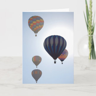 Luftballonger mot solen kort
