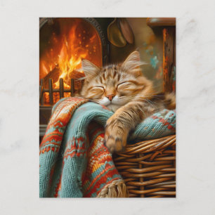 Lugn katt som sover i korg vid varm öppen spis vykort