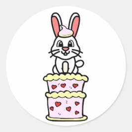 Lustigt att kanin hoppar ut ur en kaka runt klistermärke