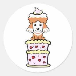 Lustigt brun hund som hoppar ut ur en kaka runt klistermärke