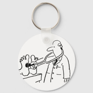 Lustigt Doktor med Stethoscope Checking Feet. Nyckelring