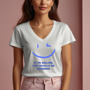 Lustigt "Om jag ler ska du springa" kvinnor T Shirt