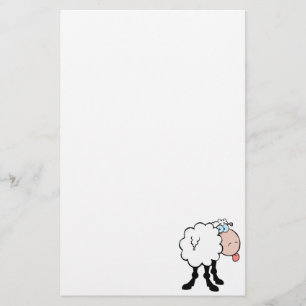 Lustigt sött får som sticker ut tunga bakifrån brevpapper