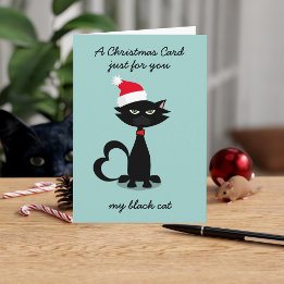 Lustigt svart katt i julklapp i Santa Hat Kort