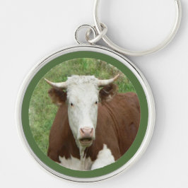 Lustigt Tittar kon i grassnyckelkedjan Rund Silverfärgad Nyckelring