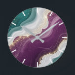 Luxury Gold Glitter Marble Pattern Rund Klocka<br><div class="desc">Soft flowing waves of teal and deep purple blend together with shimmering gold sparkles. A stylish abstract pattern with a modern and luxurious feel.</div>
