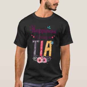 Lyckan är en Tia, som alltid är en kvinnlig Blommi T Shirt