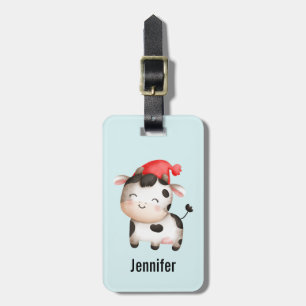 Lycklig Cow i en Cute Red Hat Bagagebricka