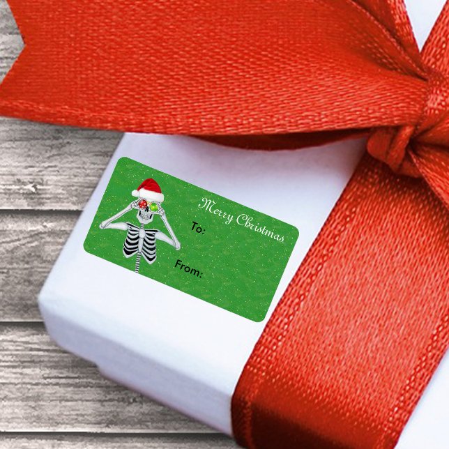 Lycklig jul Skeleton Ornament Ögon Grönt guld Adressetikett (Christmas skeleton ornament eyes Santa hat on green gift tag sticker label.)