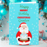 Lycklig Merry Birthday jul Santa Grandson Kort<br><div class="desc">Fira din barnsons julfödelsedag med ett kort som gnidar med glädje! Jultomten bär på en festlig födelsedagskalas,  som sammanför julens magi och hans speciella dags lycka. Ett glatt sätt att visa din morson hur älskad han är under den här julhelgen.</div>