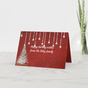 lysande julbelysning på rött med snöflingor kort
