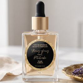 Lyxig svart och guld glitter kosmetik produkt runt klistermärke