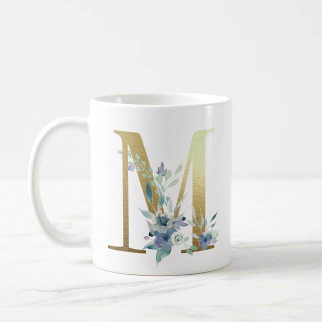 M,  förgylld initial med blå blomsterblad kaffemugg (Vänster)