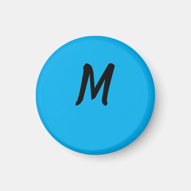 M på en blå magnet (Framsidan)
