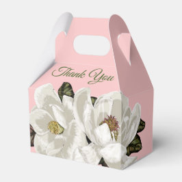 Magnolia-blommar på rosa presentaskar