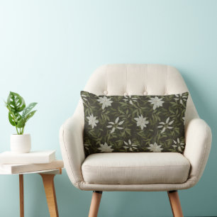 Magnolia och grönt löv på svart lumbarkudde