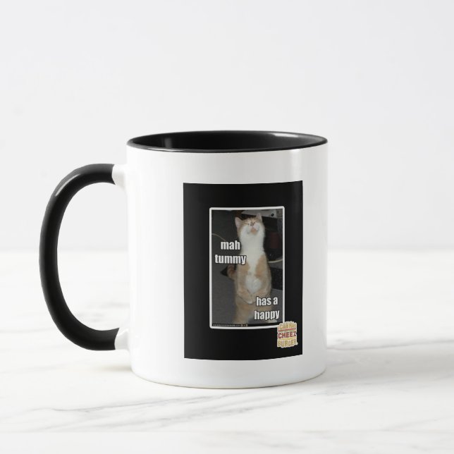 Mah-tummyen har en lycklig mugg (Vänster)