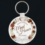 Maid of honor Rustic Fall Blommigt Utandning Bröll Nyckelring<br><div class="desc">Dessa nyckelkedjor är designade för ge som en tjänst eller gåva till Maid of honor i er bröllopsfest. De har en rustik handmålad vattenfärgskonstruktion med en krans av ro och löv i skuggor av bränt antal, rost orange och korallpersika. Texten är skriven i elegant brev, och det finns utrymme för...</div>
