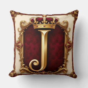 Majestätig gul monogram med krona på kunglig samme kudde