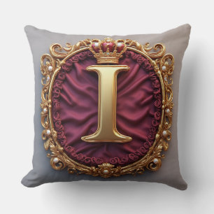 Majestätig gul monogram med krona på kunglig samme kudde