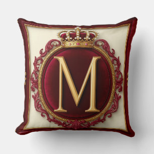 Majestätig gul monogram med krona på kunglig samme kudde