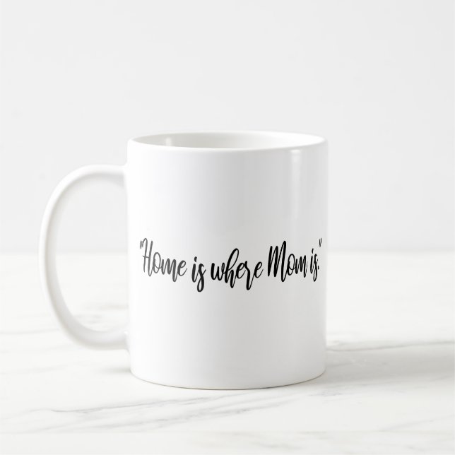 Mamma ligger i Modern Mamma Kaffemugg (Vänster)