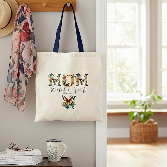 Mamma rotad i tro blommiga fjärilar tygkasse (Skapare uppladdad)