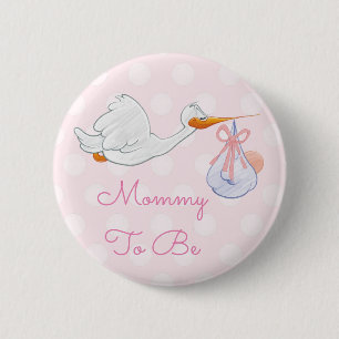 Mammor som är baby shower, knäppas den rosa knapp
