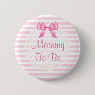 Mammor som är rosapilbågebaby shower, knäppas knapp