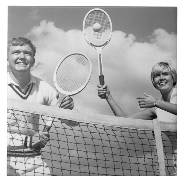 Man och kvinna som leker tennis kakelplatta (Framsidan)