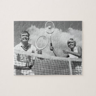 Man och kvinna som leker tennis pussel