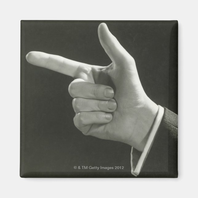 Man pekar ut magnet (Framsidan)