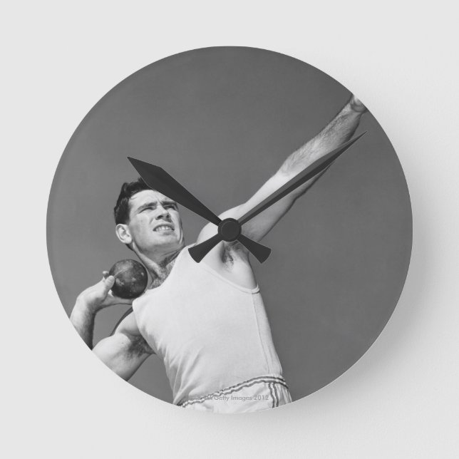 Man som kastar Shotput Rund Klocka (Framsida)