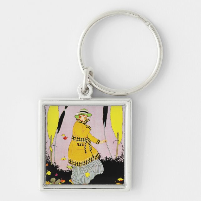 Mandel's Magazine Fyrkantig Silverfärgad Nyckelring (Framsidan)