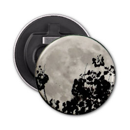 Måne bakom mörk löv flasköppnare