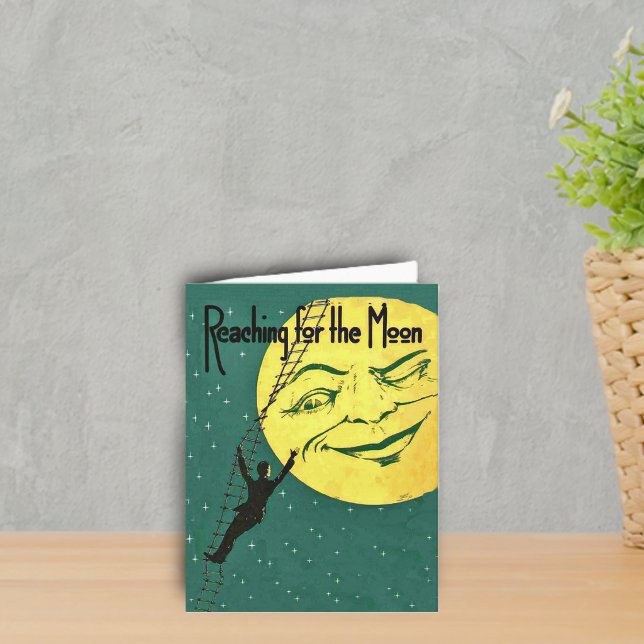 Månen nås - Notkort Kort (Man climbing ladder to reach yellow winking moon with face on emerald green with stars notecard.)