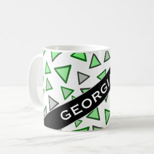 Många trianglar färgade olikt skuggar av den gr kaffemugg