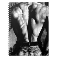 Manlig anteckningsbokteckningkroppsbyggare i jeans