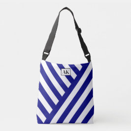 Marinblå och vitrandig väska med monogrammönster