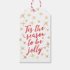 Märkre för snöflingor i guld under säsongen presentetikett