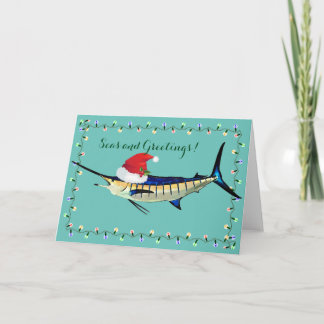 Marlin med kortet för Santa hatthelgdag Helgkort