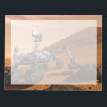 Mars Science Laboratory Curiosity Rover. Anteckningsblock<br><div class="desc">Artist concept of Mars Science Laboratory Curiosity rover, a mobile robot for investigating Mars' past or present ability to sustain microbial life. In this picture, the rover examines a rock on Mars with a set of tools at the end of the rover's arm, which extends about 7 feet. Two instruments...</div>