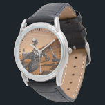 Mars Science Laboratory Curiosity Rover. Armbandsur<br><div class="desc">Artist concept of Mars Science Laboratory Curiosity rover, a mobile robot for investigating Mars' past or present ability to sustain microbial life. In this picture, the rover examines a rock on Mars with a set of tools at the end of the rover's arm, which extends about 7 feet. Two instruments...</div>