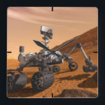 Mars Science Laboratory Curiosity Rover. Fyrkantig Klocka<br><div class="desc">Artist concept of Mars Science Laboratory Curiosity rover, a mobile robot for investigating Mars' past or present ability to sustain microbial life. In this picture, the rover examines a rock on Mars with a set of tools at the end of the rover's arm, which extends about 7 feet. Two instruments...</div>