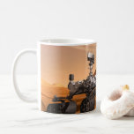 Mars Science Laboratory Curiosity Rover. Kaffemugg<br><div class="desc">Artist concept of Mars Science Laboratory Curiosity rover, a mobile robot for investigating Mars' past or present ability to sustain microbial life. In this picture, the rover examines a rock on Mars with a set of tools at the end of the rover's arm, which extends about 7 feet. Two instruments...</div>